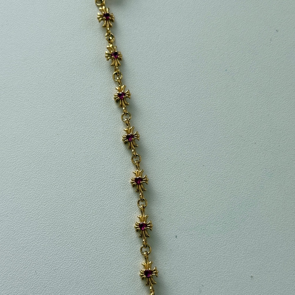 Gold-Tone Gothic Cross Bracelet with Pink Stone Accents